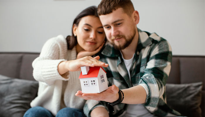 This couple is getting ready to buy their first home using our tips. 
